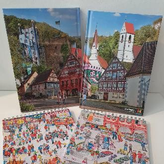 Plochinger Notizbücher und Wimmelnotizbücher mit innerstädtischen Sehenswürdigkeiten, wie z.B. das Hundertwasserhaus, "les toilettes" oder das Alte Rathaus